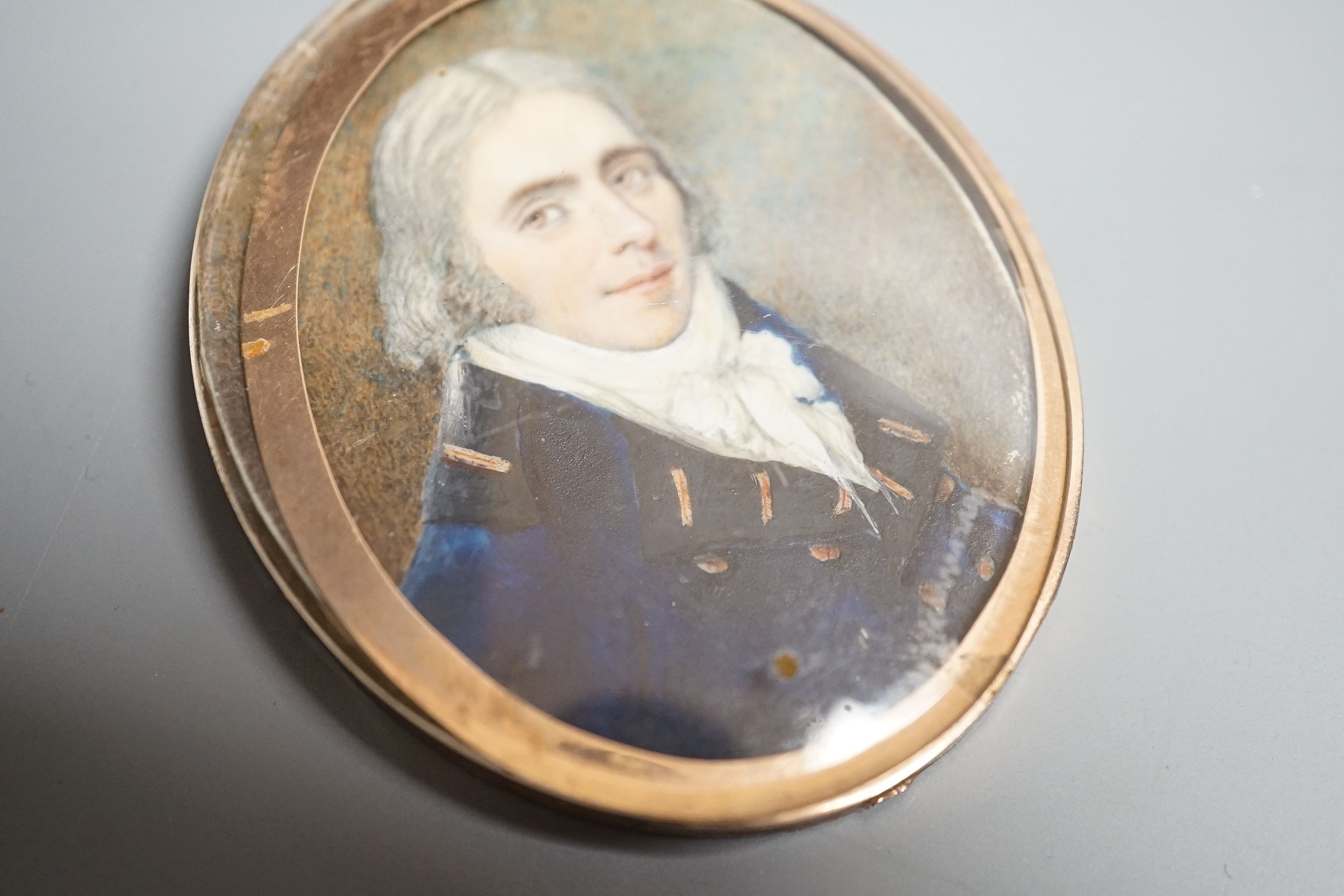 A 19th century portrait miniature on ivory of a gentleman in naval uniform, height 7cm